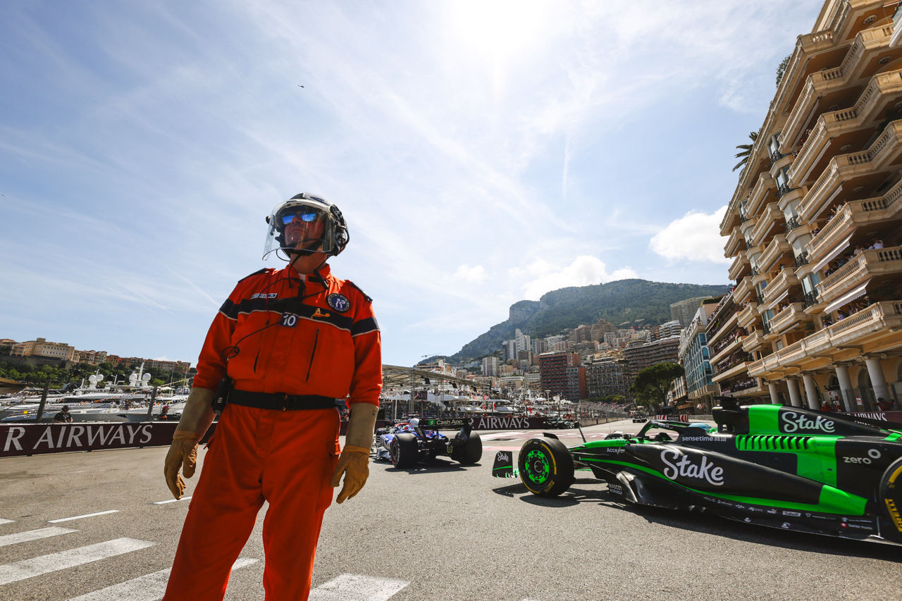 Valtteri Bottas, Stake F1 Team Kick Sauber C44, passes a marshal; 2024 Monaco Grand Prix, Formula One World Championship