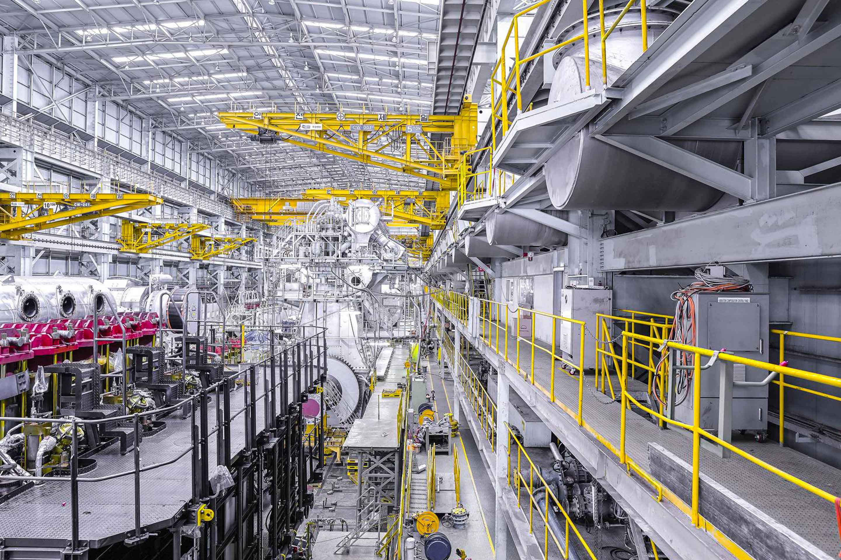 A turbocharger being assembled on an engine to highlight decarbonization in industry