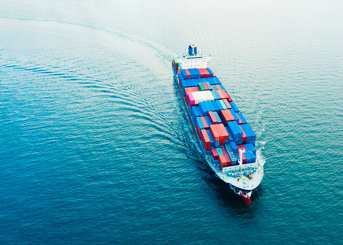 An image of a container ship at sea to represent OMT interview